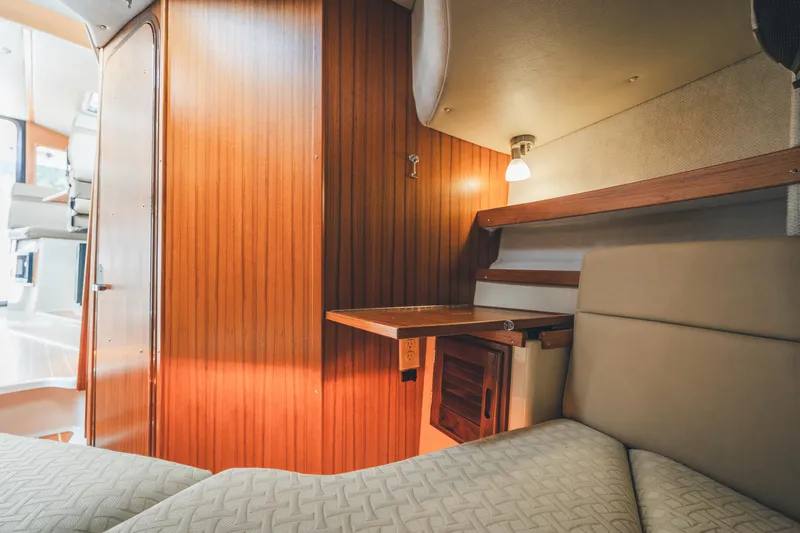 Ambraden Yacht Photos Pics 2022 Ranger Tugs R-31 CB interior with wood paneling and cozy seating area.