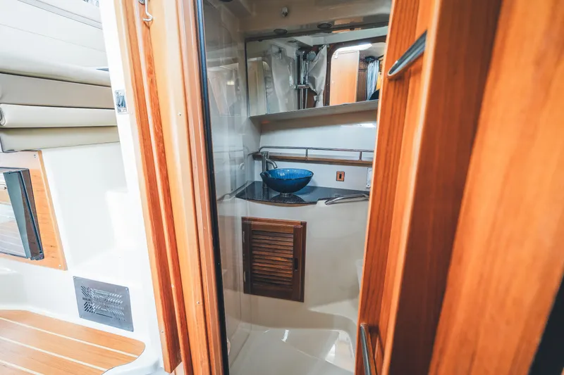 Ambraden Yacht Photos Pics 2022 Ranger Tugs R-31 CB interior with wooden finishes and modern amenities.