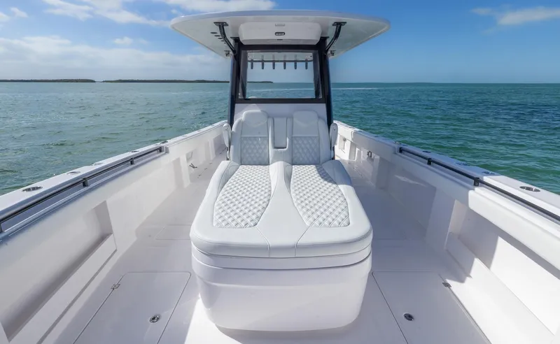  Yacht Photos Pics 2025 Invincible 35 Catamaran with luxurious seating on open water.