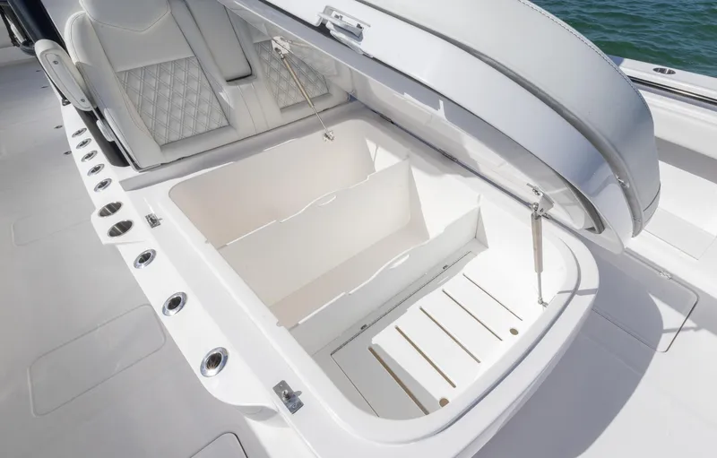  Yacht Photos Pics 2025 Invincible 35 Catamaran storage compartment with open lid, showcasing spacious interior design.
