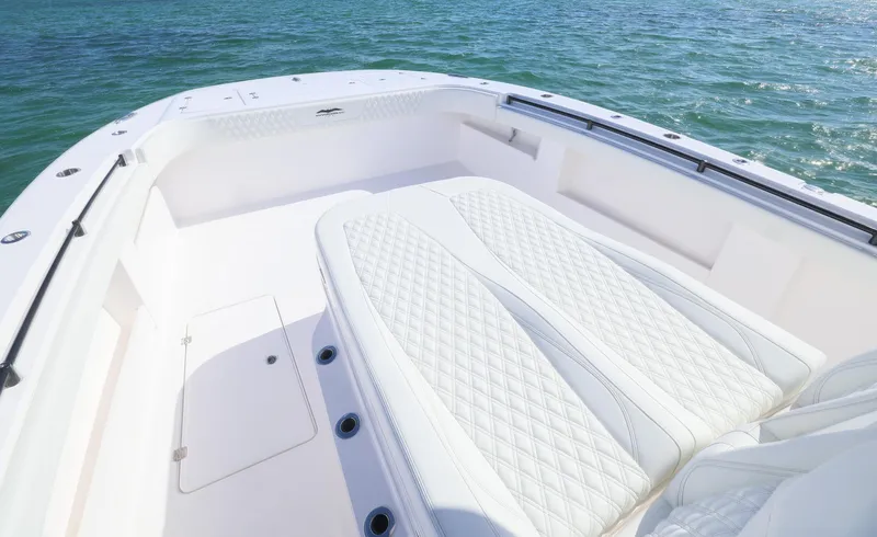  Yacht Photos Pics 2025 Invincible 35 Catamaran with luxurious seating on calm waters.