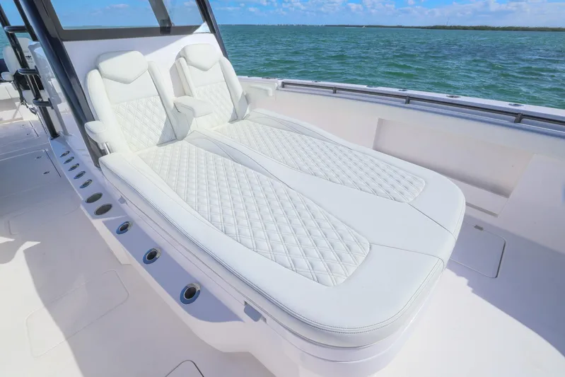  Yacht Photos Pics Luxurious seating on 2025 Invincible 35 Catamaran, featuring diamond-stitched upholstery, ocean view.
