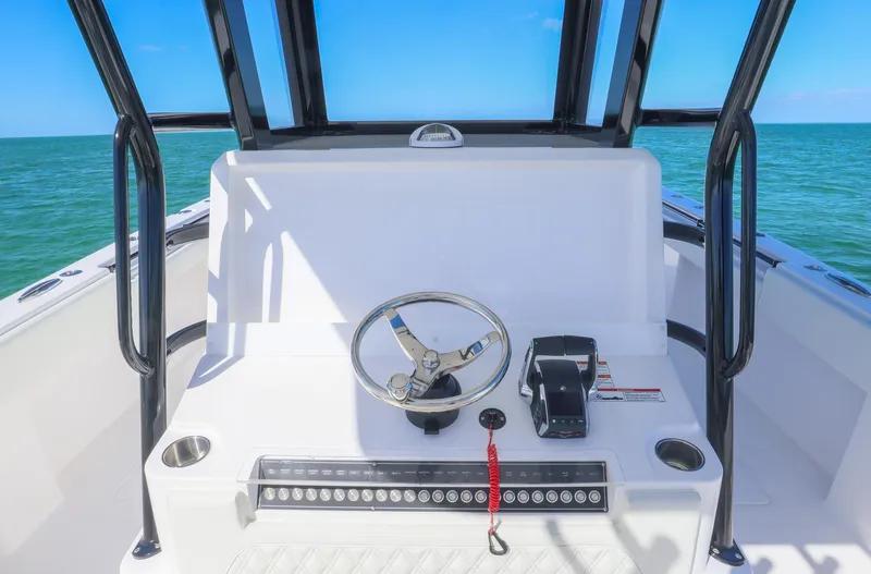  Yacht Photos Pics 2025 Invincible 35 Catamaran helm with ocean view, featuring steering wheel and controls.