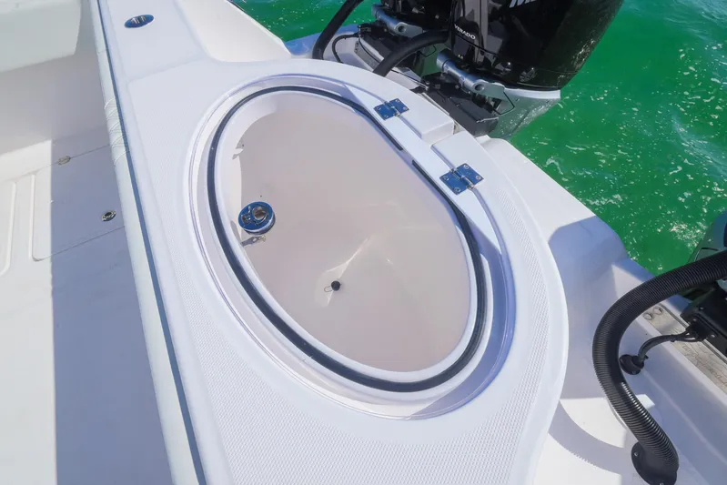  Yacht Photos Pics Invincible 35 Catamaran 2025 livewell on deck, with ocean backdrop.