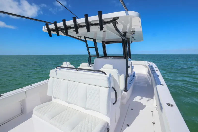  Yacht Photos Pics 2025 Invincible 35 Catamaran on open water, featuring sleek white seating and modern design.