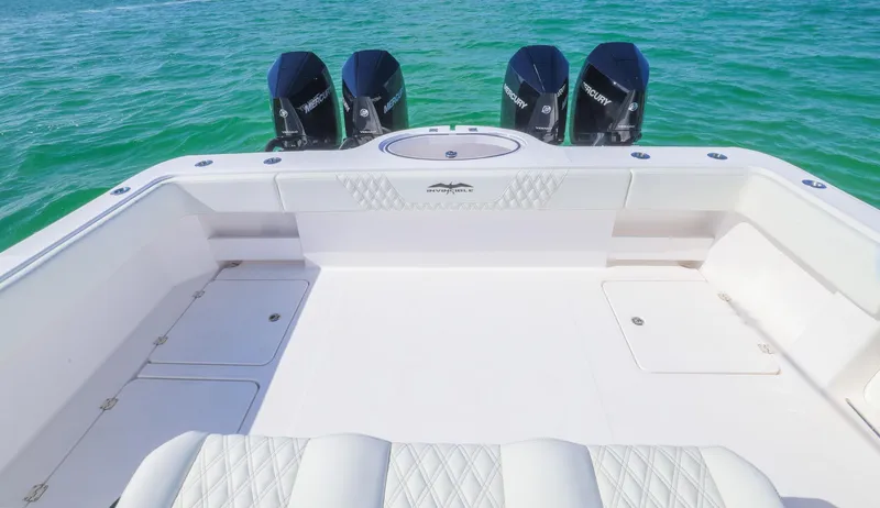  Yacht Photos Pics 2025 Invincible 35 Catamaran with quad engines on turquoise water.