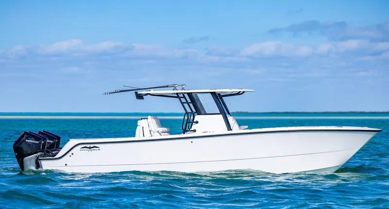  Yacht Photos Pics 2025 Invincible 35 Catamaran cruising on blue ocean waters.