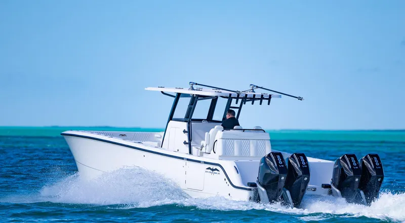  Yacht Photos Pics 2025 Invincible 35 Catamaran cruising on open water with four powerful engines.