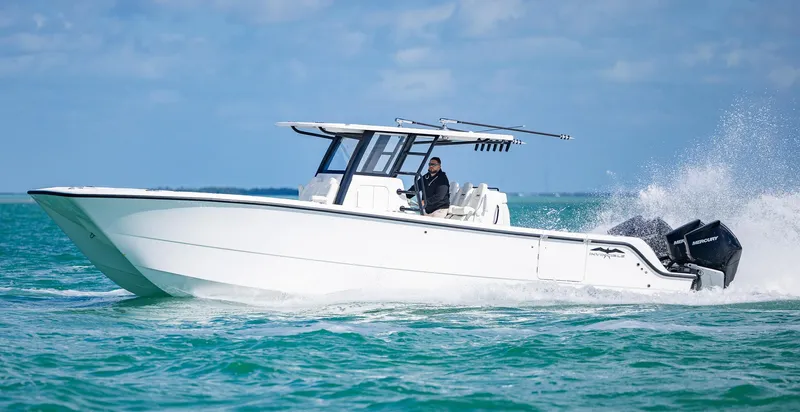  Yacht Photos Pics 2025 Invincible 35 Catamaran cruising on open water.