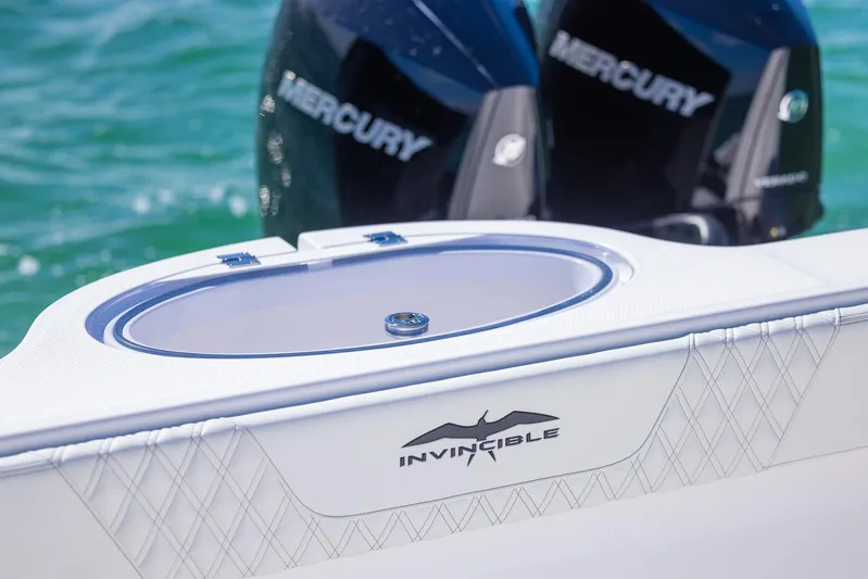  Yacht Photos Pics 2025 Invincible 35 Catamaran with Mercury engines on turquoise water.