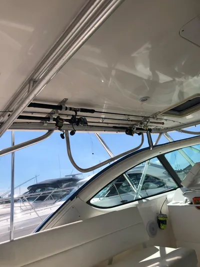 Reel Busy Yacht Photos Pics 2006 Tiara Yachts 3800 Open interior with fishing rod holders and sleek design.