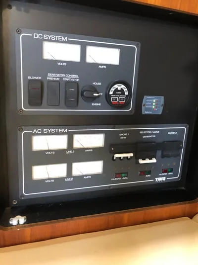 Reel Busy Yacht Photos Pics Control panel of a 2006 Tiara Yachts 3800 Open, featuring DC and AC systems.