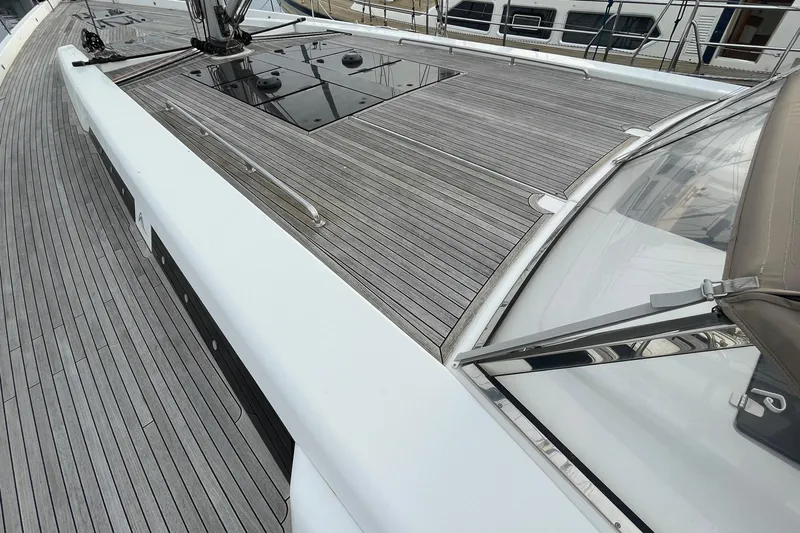  Yacht Photos Pics Deck view of 2018 Hanse 588 yacht with sleek wooden finish and modern design.