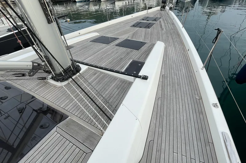  Yacht Photos Pics 2018 Hanse 588 yacht deck with sleek wooden finish and modern fittings.