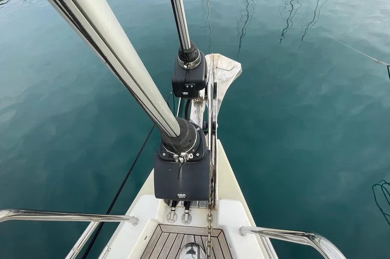  Yacht Photos Pics Bow of 2018 Hanse 588 yacht with anchor and clear blue water.