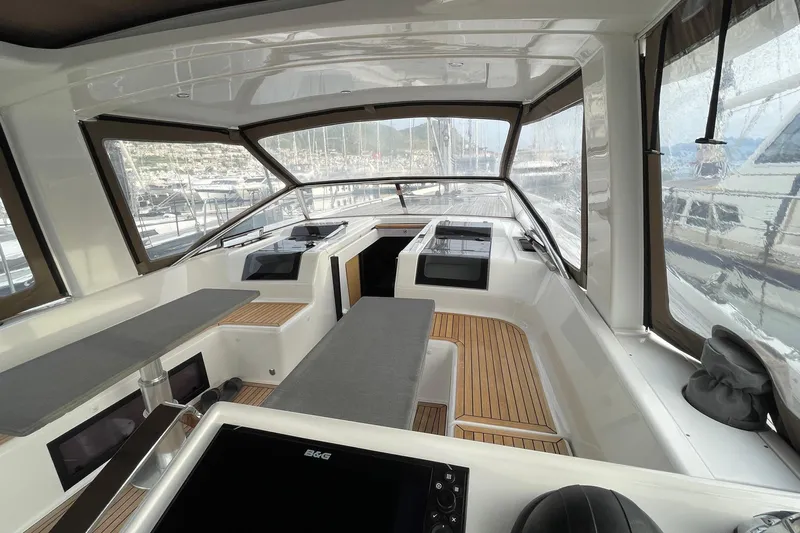  Yacht Photos Pics Interior view of 2018 Hanse 588 yacht with sleek design and wooden accents.