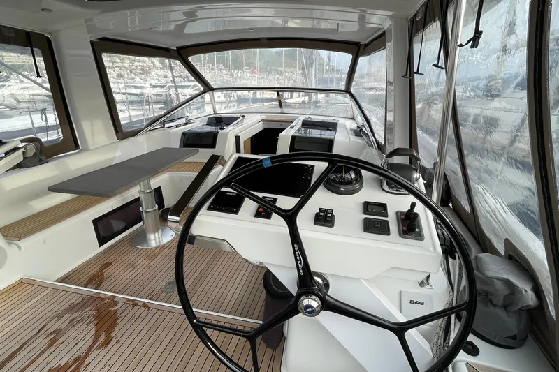  Yacht Photos Pics Interior view of 2018 Hanse 588 yacht cockpit with steering wheel and navigation controls.