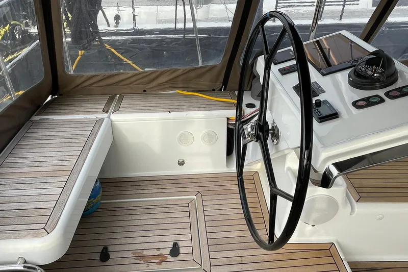  Yacht Photos Pics Cockpit of 2018 Hanse 588 yacht with steering wheel and navigation instruments.