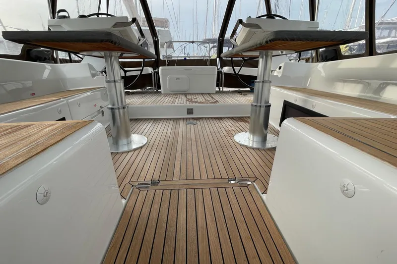  Yacht Photos Pics 2018 Hanse 588 yacht cockpit with teak flooring and dual steering wheels.