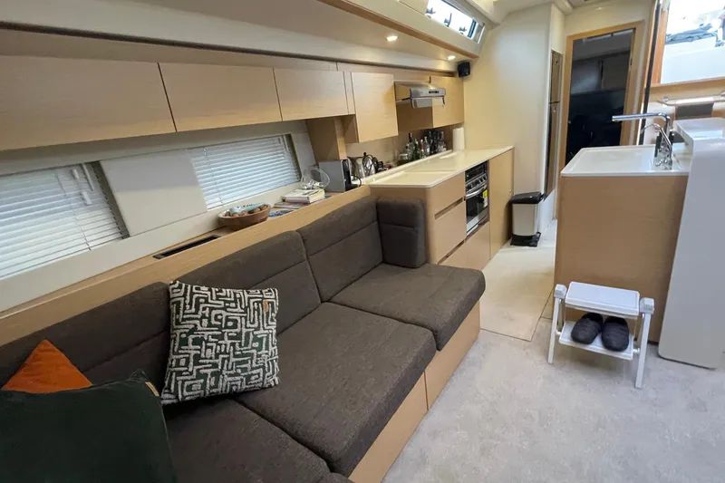  Yacht Photos Pics Interior of 2018 Hanse 588 yacht with modern kitchen and cozy seating area.