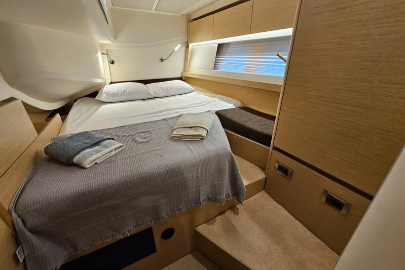  Yacht Photos Pics Luxurious cabin interior of 2018 Hanse 588 yacht with cozy bedding and modern design.