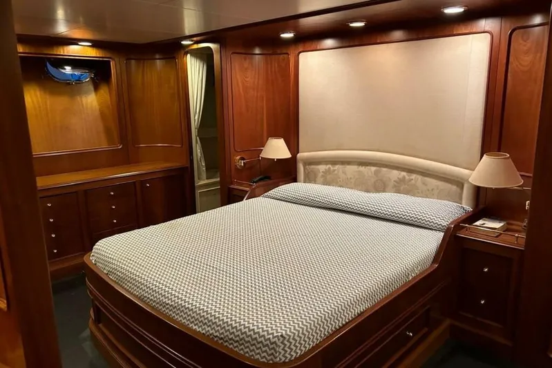  Yacht Photos Pics Luxurious Sanlorenzo 82 yacht bedroom with elegant wood paneling, 1998 model.