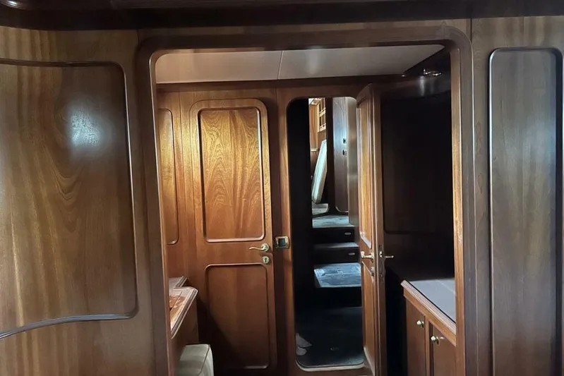  Yacht Photos Pics Interior of 1998 Sanlorenzo 82 yacht featuring elegant wooden paneling and cabinetry.