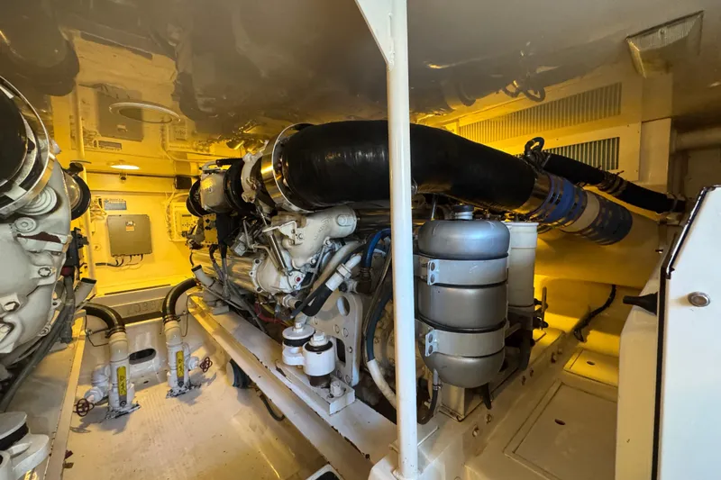 Unleashed Yacht Photos Pics Engine room of a 2007 Viking 56 Convertible yacht, showcasing machinery and components.