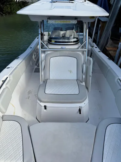  Yacht Photos Pics 2020 Sea Fox 288 Commander boat interior with cushioned seating and helm.