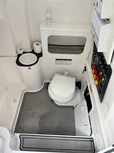  Yacht Photos Pics 2020 Sea Fox 288 Commander boat bathroom with toilet, sink, and control panel.