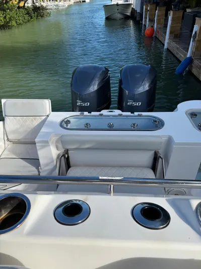  Yacht Photos Pics 2020 Sea Fox 288 Commander boat with twin 250 engines docked by the water.