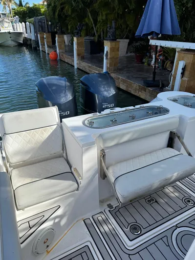  Yacht Photos Pics 2020 Sea Fox 288 Commander boat with dual engines docked by a canal.