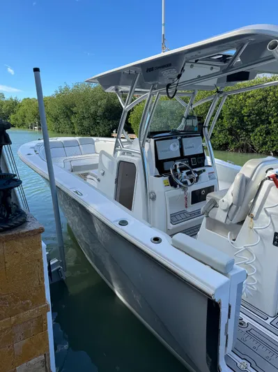  Yacht Photos Pics 2020 Sea Fox 288 Commander boat docked in a serene waterway.