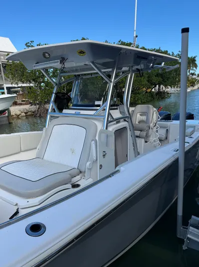  Yacht Photos Pics 2020 Sea Fox 288 Commander boat docked, featuring sleek design and spacious seating.