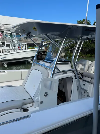  Yacht Photos Pics 2020 Sea Fox 288 Commander boat with T-top, docked near other vessels.