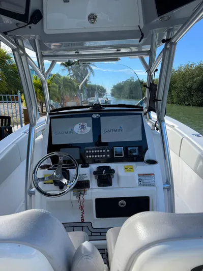  Yacht Photos Pics 2020 Sea Fox 288 Commander boat cockpit with Garmin displays and steering wheel.