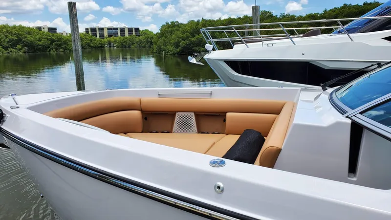  Yacht Photos Pics 2021 Aviara AV36 OB boat with tan seating, docked on a calm river.