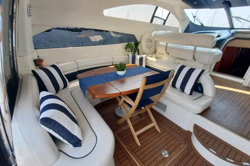 Vintage Yacht Photos Pics Luxurious 1999 Sunseeker Predator 75 yacht interior with elegant seating and nautical decor.