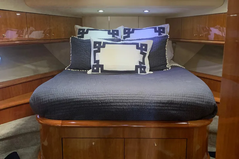 Vintage Yacht Photos Pics Luxurious cabin interior of 1999 Sunseeker Predator 75 yacht with elegant bedding.