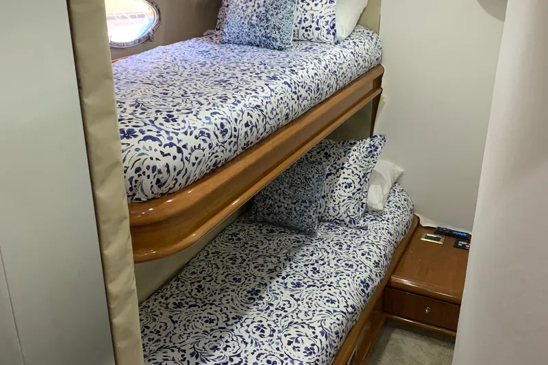 Vintage Yacht Photos Pics Bunk beds with patterned bedding in a 1999 Sunseeker Predator 75 yacht cabin.