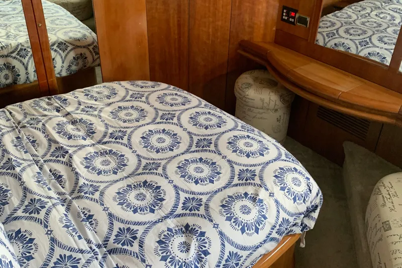 Vintage Yacht Photos Pics Luxurious cabin interior of 1999 Sunseeker Predator 75 yacht with patterned bedding.