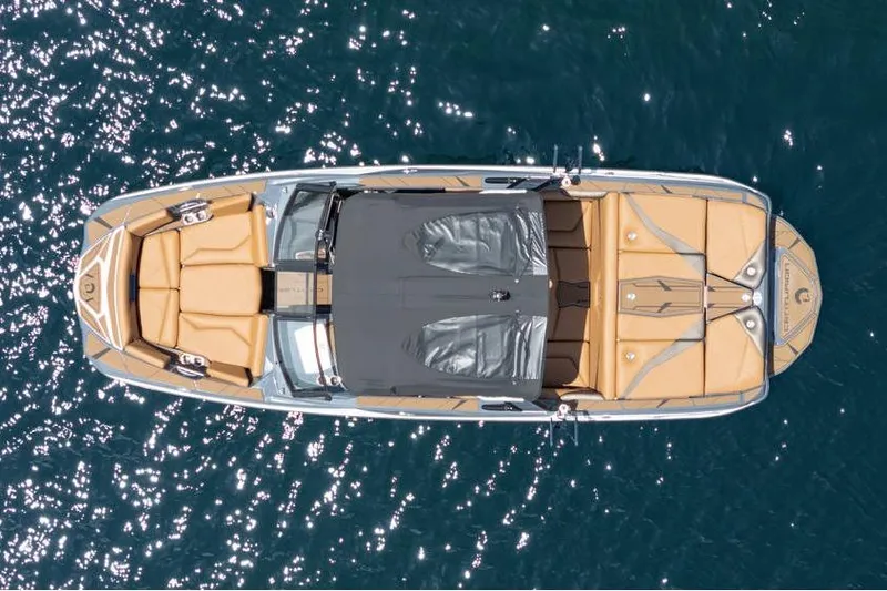  Yacht Photos Pics Top view of 2025 Centurion Nv233 boat on sparkling water.