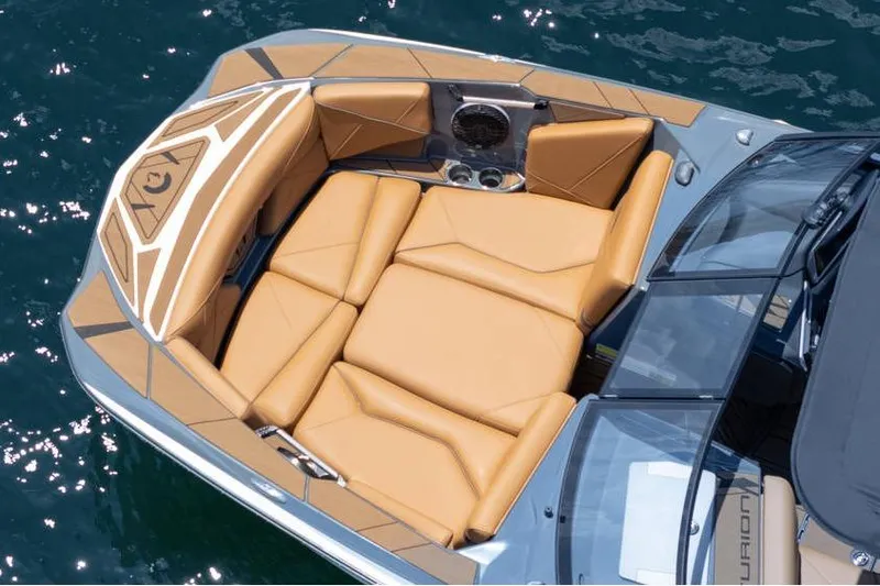  Yacht Photos Pics Luxurious seating on 2025 Centurion Nv233 boat, featuring tan upholstery and sleek design.