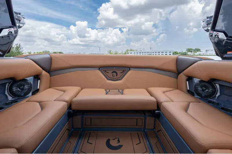  Yacht Photos Pics Luxurious interior of 2025 Centurion Nv233 boat with tan leather seating and speakers.