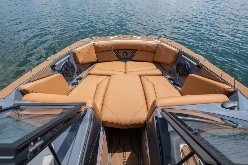  Yacht Photos Pics Luxurious interior of 2025 Centurion Nv233 boat with tan leather seating on water.