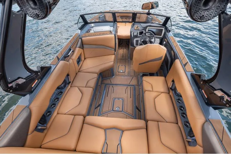  Yacht Photos Pics Luxurious interior of 2025 Centurion Nv233 boat with tan leather seating on water.