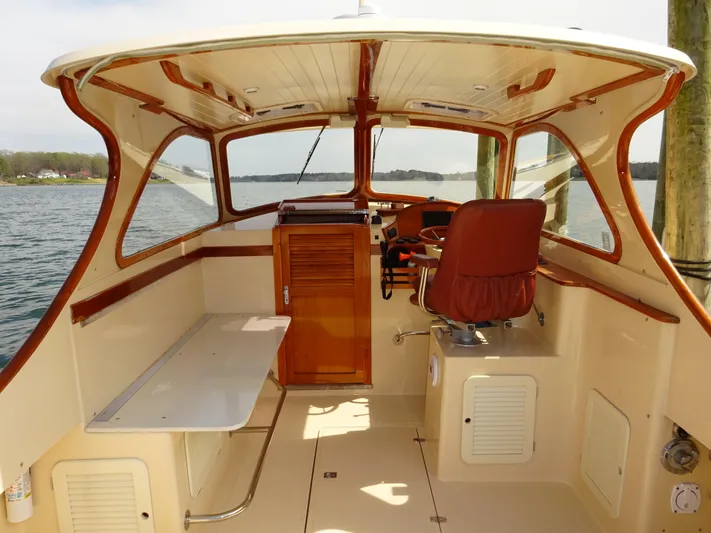 Blue Moon Yacht Photos Pics 1995 Hinckley Picnic Boat Classic interior with wooden accents and steering wheel.