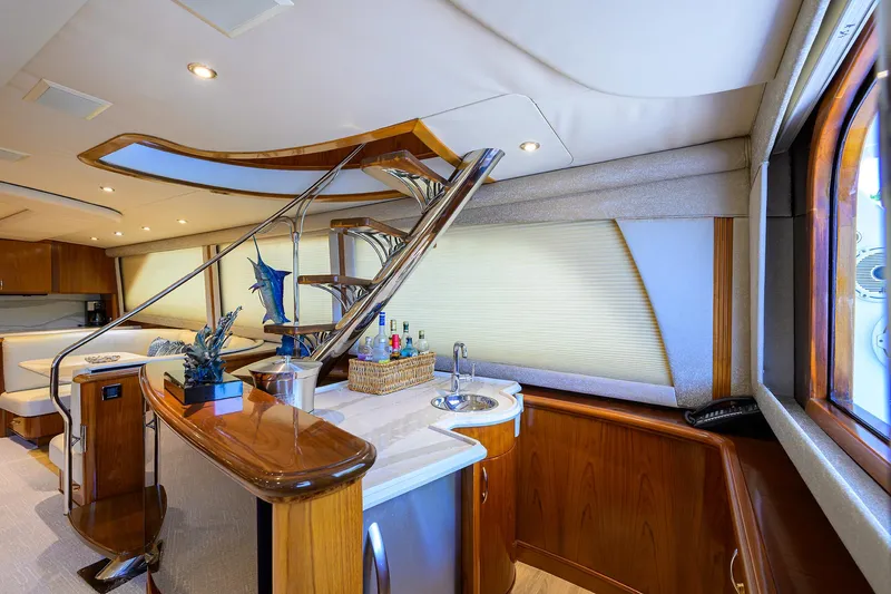 Jr Yacht Photos Pics Luxurious interior of 2004 Sea Force IX 82 Enclosed Bridge yacht with elegant wood finishes.