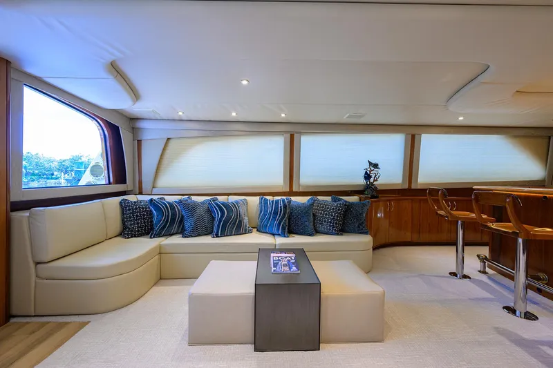 Jr Yacht Photos Pics Luxurious interior of 2004 Sea Force IX 82 Enclosed Bridge yacht with plush seating and elegant decor.