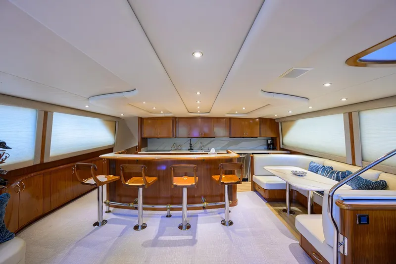Jr Yacht Photos Pics Luxurious interior of 2004 Sea Force IX 82 Enclosed Bridge yacht with modern seating and bar area.